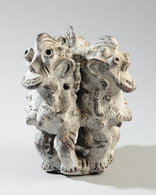 Bamileke Terracotta Figural Group: Three magical figures with mask-like faces arranged facing outward in a circle. Terracotta with white pigment. Bamileke people, Cameroon. approx. 9" in height. Provenance: Estate of Thomas McNemar, (1