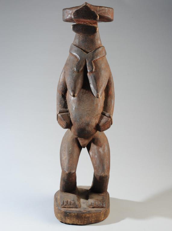 Mama Reliquery Figure Nigeria: Carved wood figure having cubist bush cow head or mask and a human female body, with a scarf around the neck. Mama people, Nigeria. Approx. 27 1/2" in height. Provenance: Estate of Thomas McNemar, (19