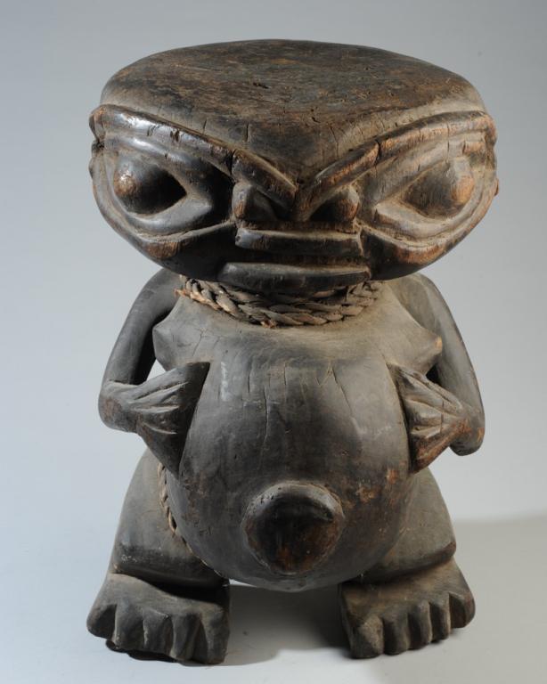 Bamileke Figural Stool Cameroon: Carved hard wood stool. Approx. 19" in height. Provenance: Estate of Thomas McNemar, (1931-2019.) McNemar lived and collected throughout Central and West Africa in the 1960s and 70s. He established ga