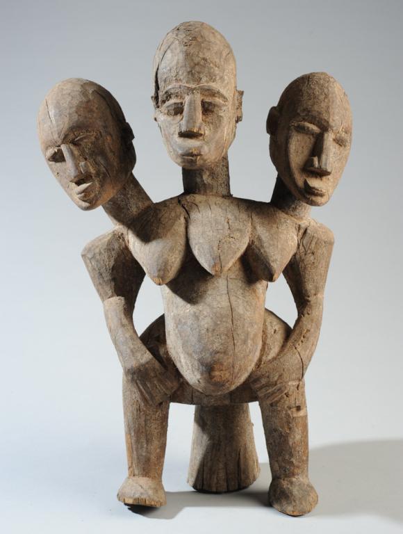 Lobi Three-Headed Figure: Carved wood seated female figure with three heads, three breasts. Lobi people, Burkina Faso. Approx. 16" in height. Provenance: Estate of Thomas McNemar, (1931-2019.) McNemar lived and collected throu