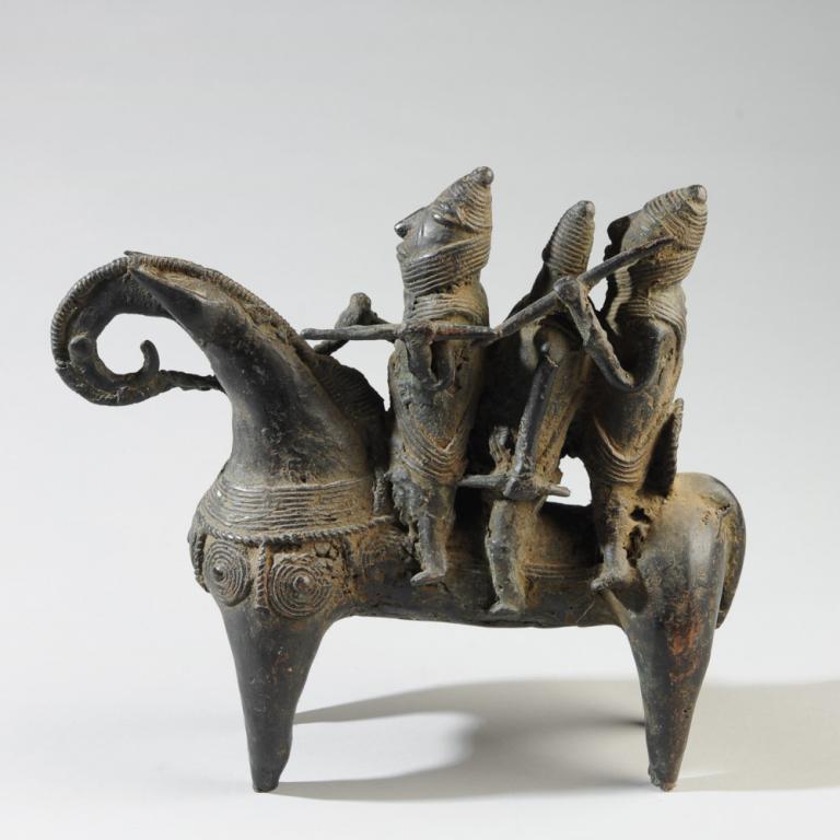 Kotoko Bronze Equestrian Statue: Three warriors bearing weapons astride a well appointed horse. Bronze with a deep black patina. Kotoko people, Chad. Approx. 10" in height, 12 1/4" long. Provenance: Estate of Thomas McNemar, (1931-20