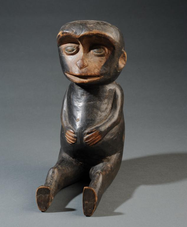 Baule Seated Monkey Figure: Carved wood with black pigment. Baule people, Ivory Coast. Approx. 11" in height. Provenance: Estate of Thomas McNemar, (1931-2019.) McNemar lived and collected throughout Central and West Africa in t