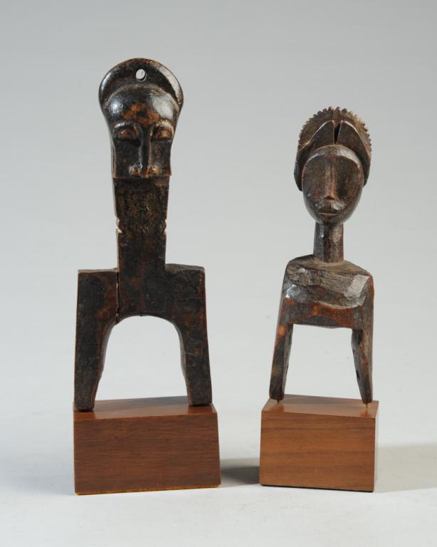 Two West African Figural Heddle Pulleys: Both on gallery bases. The larger pulley, approx. 7" H., with base, 8 3/4" H. Provenance: Estate of Thomas McNemar, (1931-2019.) McNemar lived and collected throughout Central and West Africa in the 1