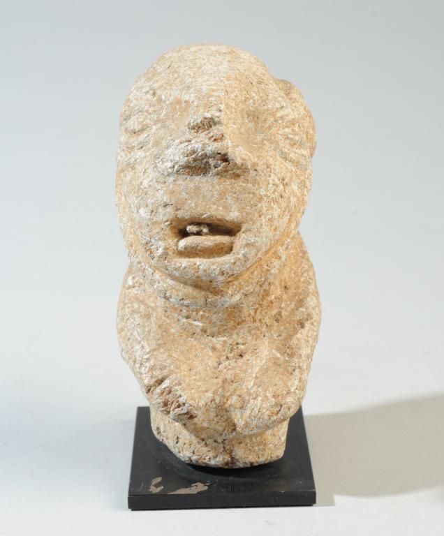 Kissi Stone Head or Half Figure Nomoli Pomdo: Carved stone figure with large head and what may be arms/shoulders. Bulging eyes, wide nose, open mouth, possibly a beard. Kissi stone figures are of mysterious origin, found by farmers in Liberia, Si