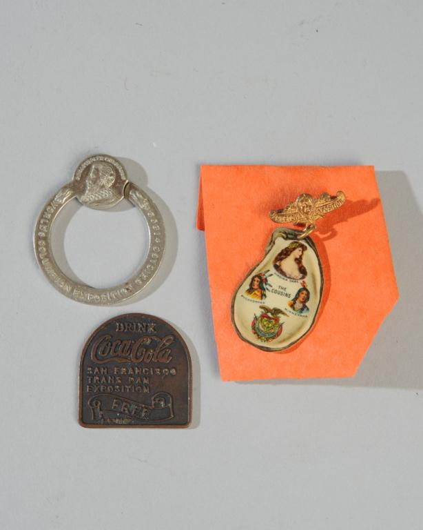 World's Fair Lot: Jamestown Expo "Virginia Dare" pin, San Francisco Trans Pan Expo Coca Cola token, 1893 Columbian Expo keychain.