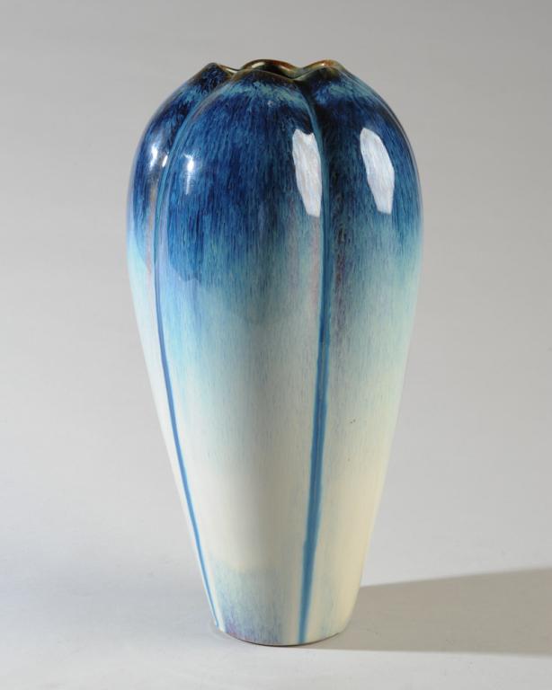 Blue Flambe Glaze Lobed Art Pottery Vase: Tall lobed art pottery vase with blue flambe vase, no maker's mark, no visible chips, cracks or repairs.H: approx. 12".