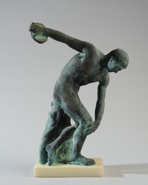 Bronze Figure after The Discus Thrower: After the classical figure "The Discobolus of Myron" by Athenean sculptor Myron of Eleutherae. Bronze or similar, heavy greenish patina, mounted to marble base. Approx. 13" H.