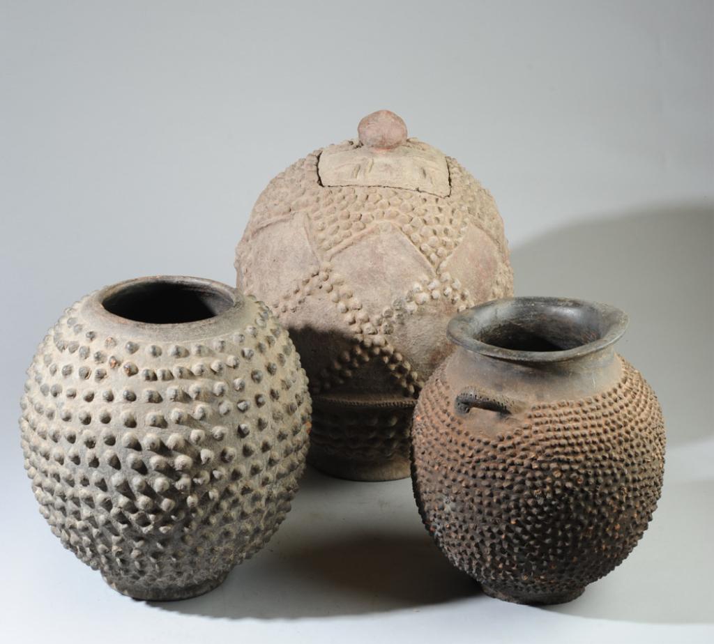 Three African Lobi Pottery Vessels: West African terracotta vessels with applied pottery studs. Lobi people, Burkina Faso. 20th C. Approx.12", 16" and 13 1/2" in height. Provenance: Estate of Thomas McNemar, (1931-2020.) McNemar lived a