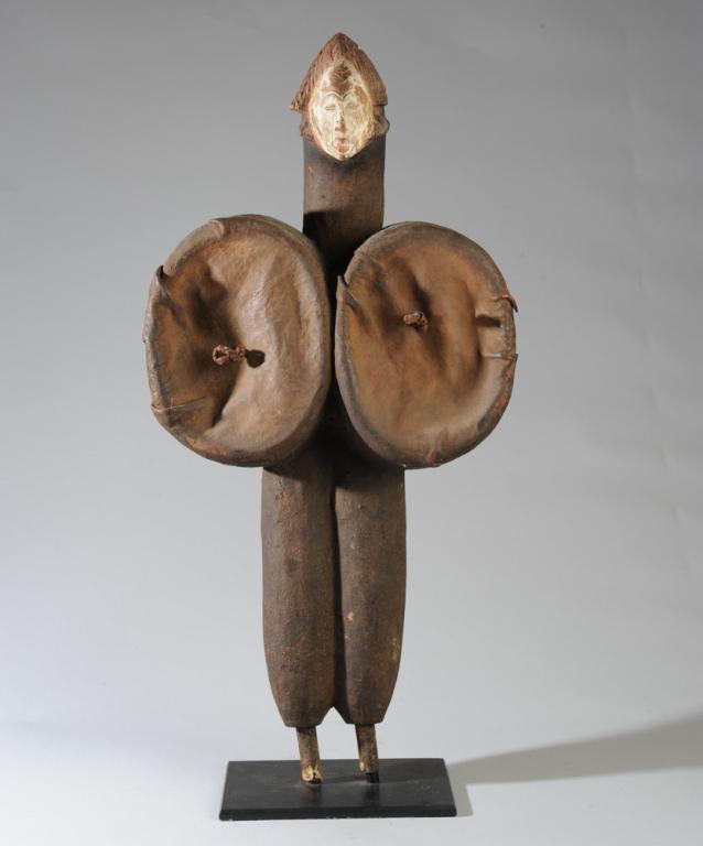 Punu Blacksmith Bellows: Carved wooden figural bellows, Punu people, Gabon. Wood, pigment and leather. On custom gallery base. Approx. 29" in height. Provenance: Estate of Thomas McNemar, (1931-2020.) McNemar lived and collec