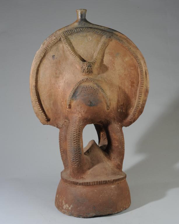 Dakakari Terracotta Elephant Figure: Janiform elephant funerary figure of the type used to mark the graves of chiefs, warriors, great hunters, and other important personages. Dakakari people, Nigeria. Minor repairs. Approx. 32" in height