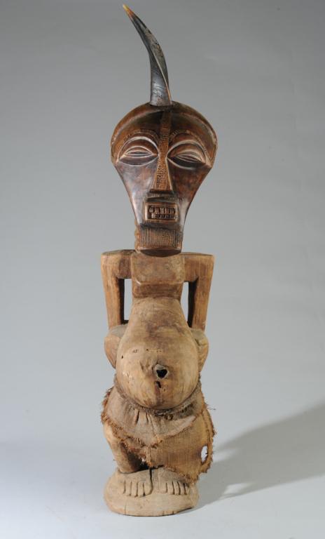 Songye Nkishi Power Figure: Due to size possibly a community power figure. Carved wood with metal and fiber, horn embedded in top of head. Approx.38 1/2" in height. Provenance: Estate of Thomas McNemar, (1931-2020.) McNemar live