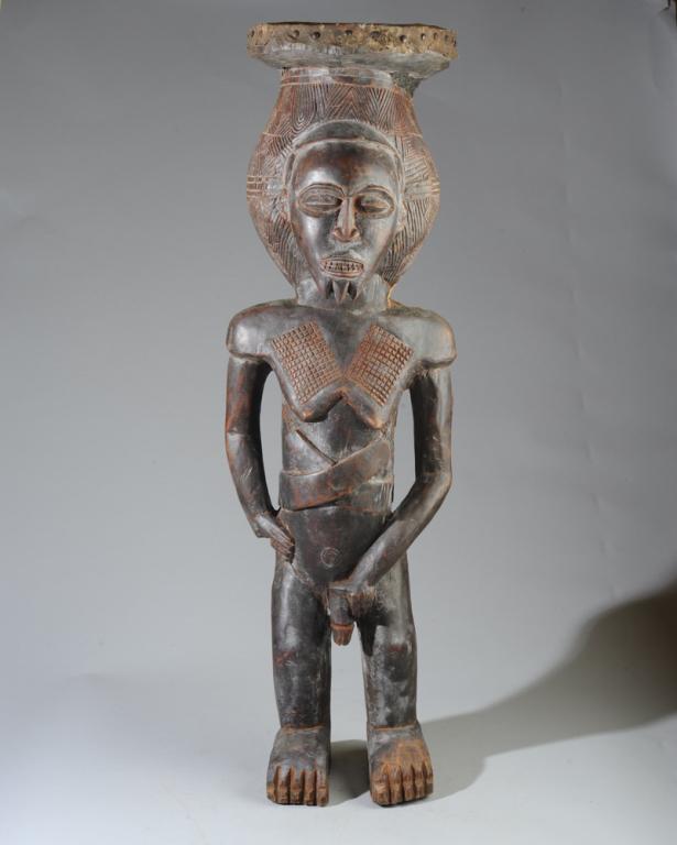 Zaire Figural Drum: Drum in the form of a standing male figure. Carved wood, animal skin. Zaire, now Democratic Republic of Congo. Approx. 38" in height.Provenance: Estate of Thomas McNemar, (1931-2020.) McNemar lived an