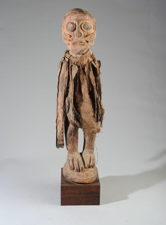 Fon Power Figure / Fetish, Benin: Standing figure of carved wood, pigment, cloth. Fon people, Benin. On gallery stand. Approx. 29" in height 33" in height including stand.Provenance: Estate of Thomas McNemar, (1931-2020.) McNemar live