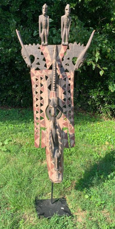 Large Elaborate Bamana Cimier Mask: Monumental and detailed Bamana cimier dance mask with multiple figures including antelopes, humans, and a dog or hyena in the act of catching an antelope by the tail. Carved wood with pigments.H: appr