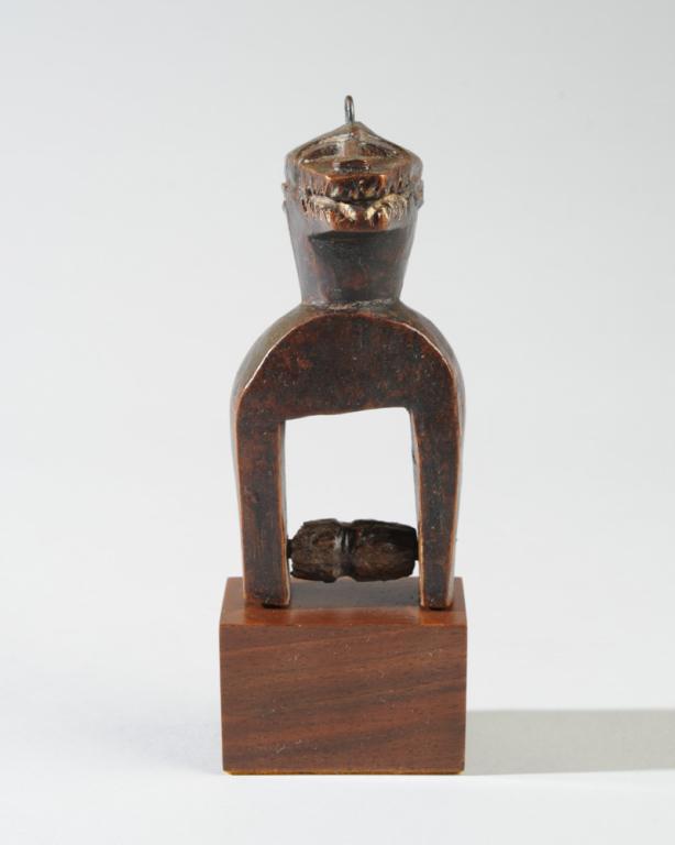 African Heddle Pulley, Ivory Coast: Zoomorphic pulley. Baule or Guro. On gallery stand. Approx. 5" H. (6 3/4" with stand.) Provenance: Estate of Thomas McNemar, (1931-2020.) McNemar lived and collected throughout Central and West Africa