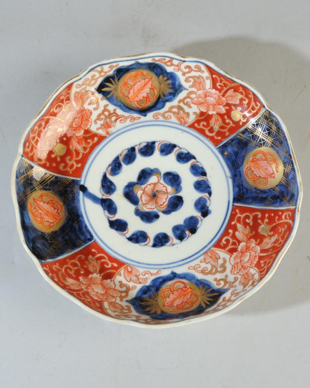 Meiji Japanese Imari Plate: With scalloped rim, and underglaze blue with red and gilt enamel decoration. Base with four character Fuki Choshun mark in underglaze blue. Minor wear, no chips or cracks. Approx. 8 1/4" diameter.
