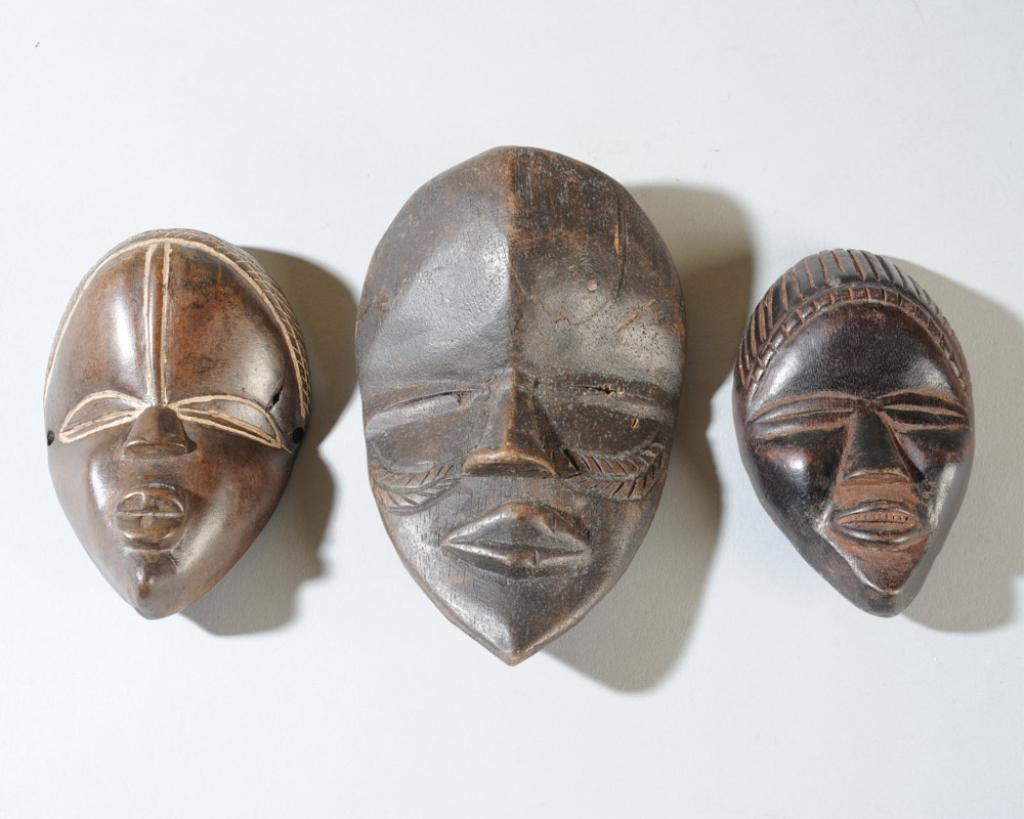 Three Dan Passport / Miniature Masks: Dan people, Liberia. Approx. 5 3/4" x 3 3/4", 4 1/2" x 3", and 4 1/2" x 2 3/4". Provenance: Estate of Thomas McNemar, (1931-2020.) McNemar lived and collected throughout Central and West Africa in the