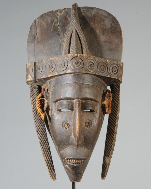 Marka Mask, Mali: Anthropomorphic carved wood mask with large elaborate headdress, long plaits, ears embellished with coiled and wrapped wire, the elongated face with close set eyes, long aquiline nose, protruding mout