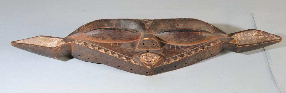 Eastern Pende Mask: Eastern Pende "panya ngombe" buffalo mask. Carved wood and pigments. Approx. 30" x 8". Provenance: Estate of Thomas McNemar, (1931-2020.) McNemar lived and collected throughout Central and West Africa