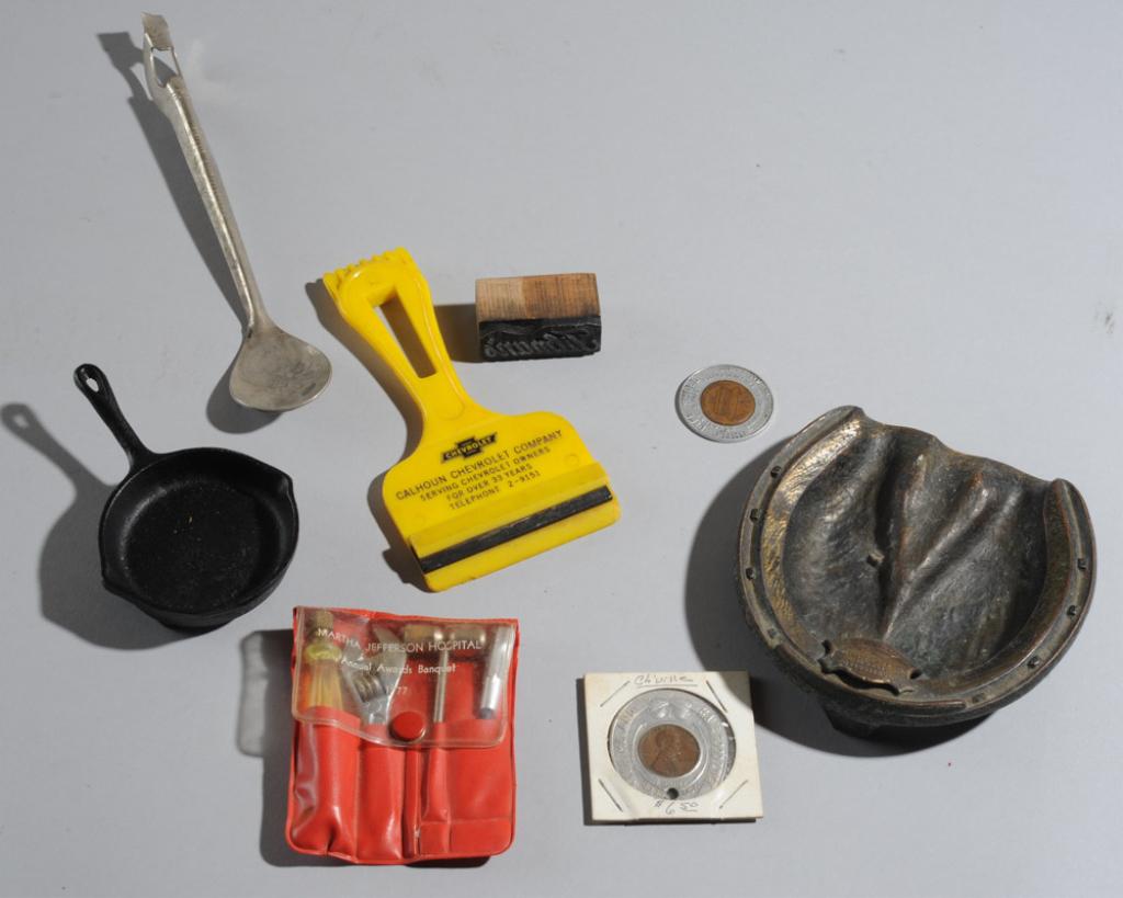 Charlottesville Lot: Calhoun Chevrolet ice scraper, Monticello ash tray, Martha Jefferson Hospital 1977 awards banquet tool set, West Main Super Market miniature cast iron skillet, Citizens Bank and Keystone Shoes lucky p