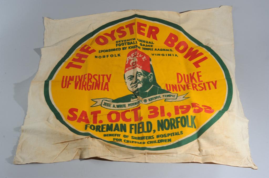 1953 Oyster Bowl UVA Vs. Duke Banner Poster: Big stencil or silkscreen on cotton banner or poster in bold red, green and gold for the October 31 1953 Oyster Bowl football game between the University of Virginia and Duke University at Foreman Fie