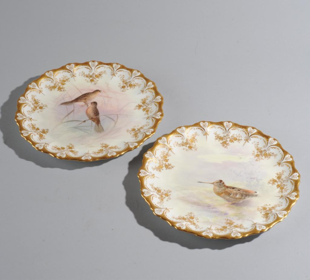 Pr. Royal Doulton for Tiffany, S. Wilson Plates: The centers with hand painted game birds signed S. Wilson and surrounded by gilt encrusted scalloped edge with garlands of gilt flowers. Marked Royal Doulton, England and Tiffany & Company, New York, 