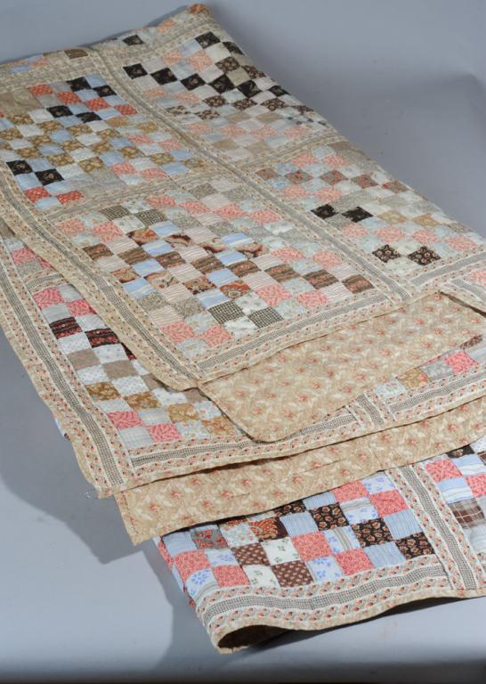 19th C. Block Quilt for 4 Poster Bed: Hand stitched blocks of small calico squares joined by long strips of ribbon-patterned cotton, the lower corners cut in to allow for tall bed posts. Very good condition, no odors, wrinkling or puckeri