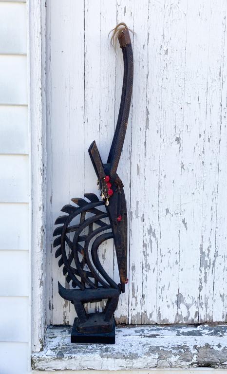 Large Bamana / Bambara Chiwara Headdress: Northern style antelope headdress, with graceful and highly abstract three headed figure of an antelope with curved openwork body, the four long spiral-carved horns tipped with hide and animal hair ta