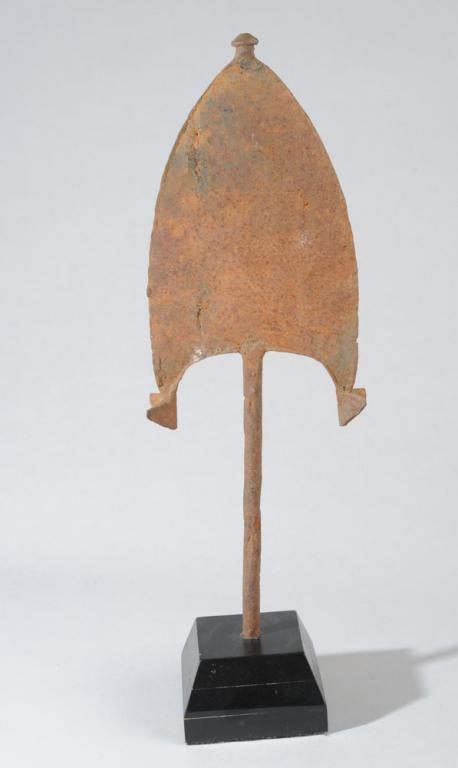 Bangala Spear Tip Currency: Iron with weathered surface, the sharp point with knob end. Bangala people, Democratic Republic of Congo. On custom gallery stand. Height, including stand, approx. 20". Provenance: Estate of Thomas Mc