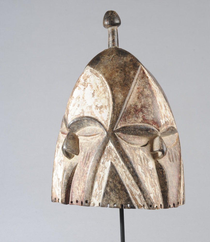 Kota Four-Face Helmet Mask: LOT ORIGINALLY UPLOADED INCORRECTLY WITH PHOTOS OF LOT 95. THE CORRECT PHOTOS WERE ADDED ON THE EVENING OF 3/7. Bell shaped wooden mask with four opposing faces, the simplified features given graphic 
