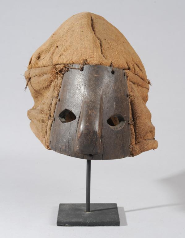 Chokwe Fiber Mask: Woven fiber and wood mask. On custom gallery stand. Mask approx. 8 1/2" H. Provenance: Estate of Thomas McNemar, (1931-2020.) McNemar lived and collected throughout Central and West Africa in the 1960