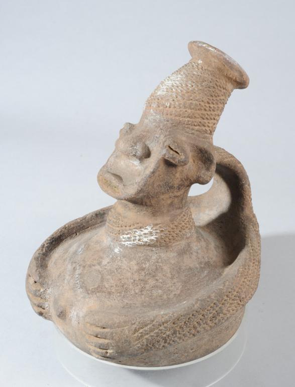 Mangbetu Terracotta Vessel, D. R. Congo: Figural vessel in the form of a woman, with the elongated head and high, flaring crown of braids that embodies the Mangbetu ideal of feminine elegance. (The inspiration for Beyonce's most iconic look