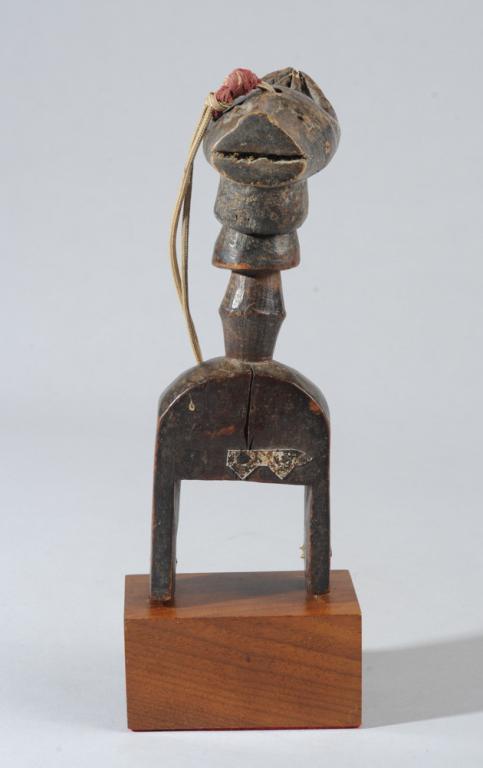 Baule Bo Nun Anuin Heddle Pulley: Carved wood heddle pulley with finial in the form of the zoomorphic Bo Nun Anuin mask. The mask is attached so that it bobbles engagingly on the long neck. Baule artist, Ivory Coast. On custom gallery