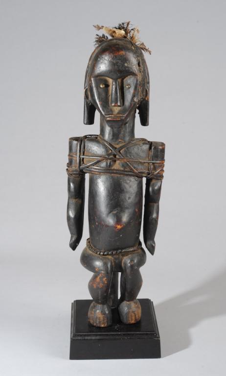 Articulated Fang Byeri Reliquary Figure (Ntumu): Seated reliquary guardian figure with arms held straight down and articulated at the shoulders, useful when the figure was used as a puppet during initiation rites. Metal tack eyes give intensity to e