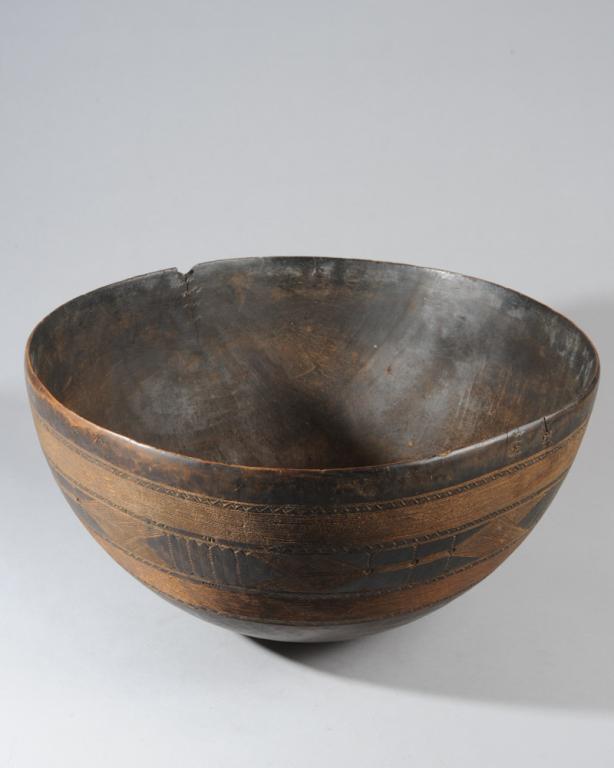 Large Nupe Bowl, Nigeria: With delicate geometric figures etched to exterior. Old rim chip. Approx. 19 1/2" diameter, 10" in height. Provenance: Estate of Thomas McNemar, (1931-2020.) McNemar lived and collected throughout Cen