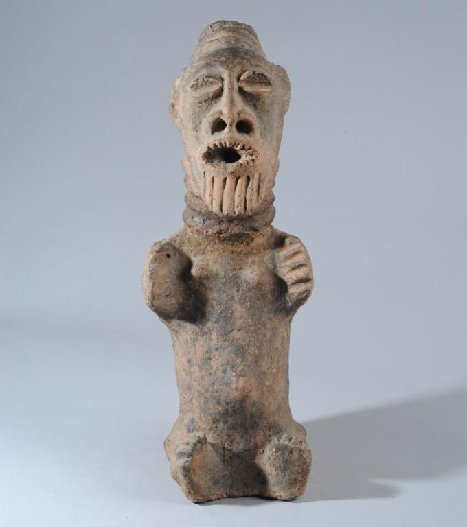 Agni / Anyi Terracotta Memorial Figure: Seated Mma figure with large, slightly tipped back head with headdress and beard, ringed neck, short body with truncated arms and legs. Likely Krinjabo, Sanwi region, Ghana. Approx. 22" H. Provenance:
