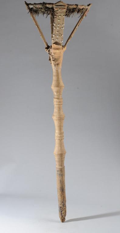 Tuareg Bowl Stand: Carved wooden post with round support for bowl, incorporating animal hide, raffia and metal tacks. Tuareg nomadic tribe, Sahara region. Post, approx. 45" H. Provenance: Estate of Thomas McNemar, (1931