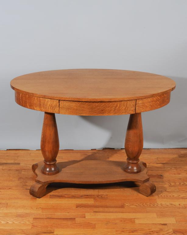 Empire Style Oak Single Drawer Library Table: Oval top, dovetailed drawer, some surface wear / in as-found condition.H: approx. 29 1/2".Top: approx. 42" x 26".
