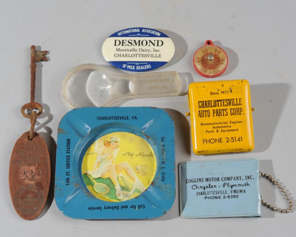Charlottesville Lot: Charlottesville Auto Parts paper clip, Coggins Motor Company key case, Monticello Dairy name badge, Queen Charlotte Hotel room key, naughty ashtray, etc.