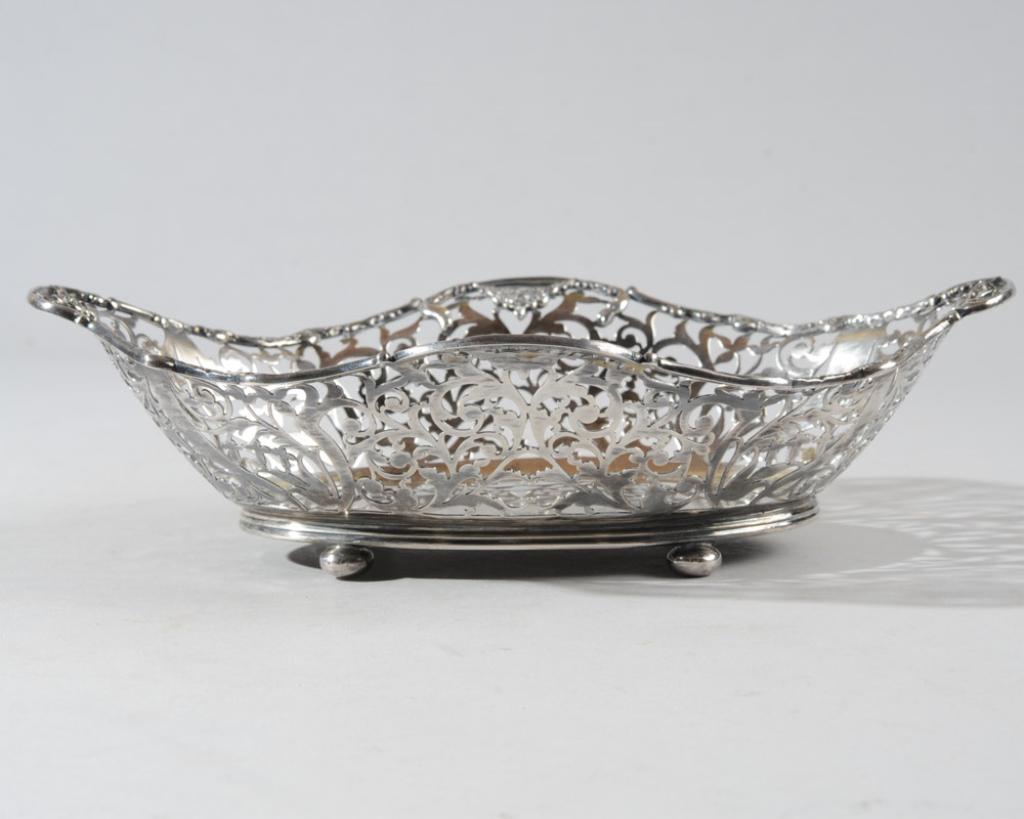 English Sterling Reticulated Bowl: Hallmarks for Chester, England, 1915, makers: George Nathan & Ridley Hayes H: approx. 2 1/2"W: approx. 10"D: approx. 7"Weight: 10.5 Ozt
