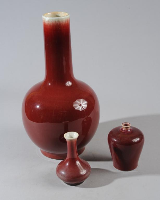 3 Chinese Sang de Boeuf Vases: Largest with 1/2" chip to rim. All unmarked. Tallest: 13"