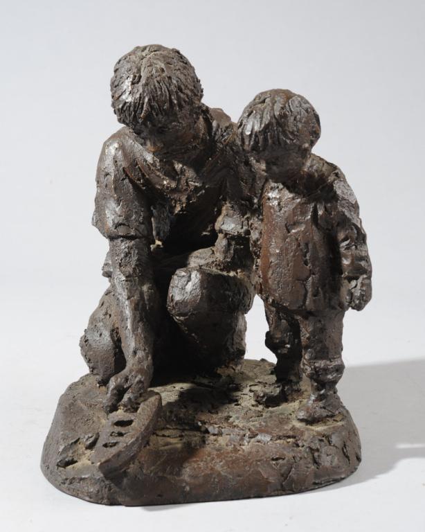 Kari Juva (1939-2014) Father & Son Sculpture: Limited edition sculpture of a father kneeling beside his young son as they launch a small toy boat, by the renowned Finnish sculptor Kari Juva. Signed KJ and numbered 401/500. Bronze finish stone com