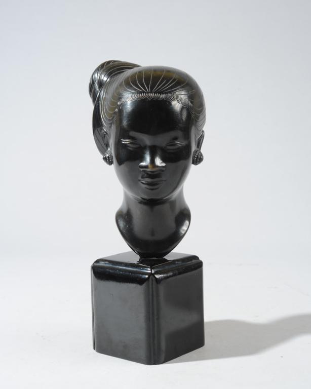 Nguyen Thanh Le Bronze Head of a Young Woman: Bronze head of a young Laotian or Vietnamese woman by or after Vietnamese artist Nguyen Thanh Le, (1919-2006.) Inscribed mark to back of neck. Affixed to lacquered wood base. Sculpture: approx. 7" H. 