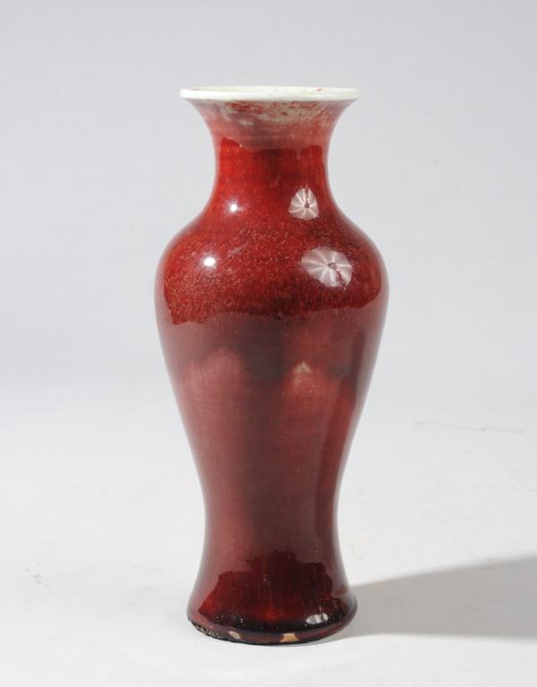 Chinese Langyao Baluster Vase Qing: Chinese flambe vase in a variegated deep sang de bouef glaze thinning to faintly greenish white at the everted rim, dark blackish red near the base. Faint gold crackle in the glaze, most visible at th