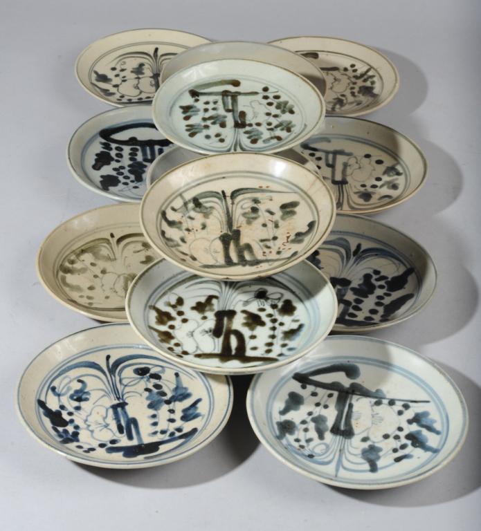 Thirteen Ming Swatow Blue & White Plates: All with similar decoration, varying shades of blue, with unglazed foot rims, firing flaws. Minor variation but most about 6 1/4" diameter.