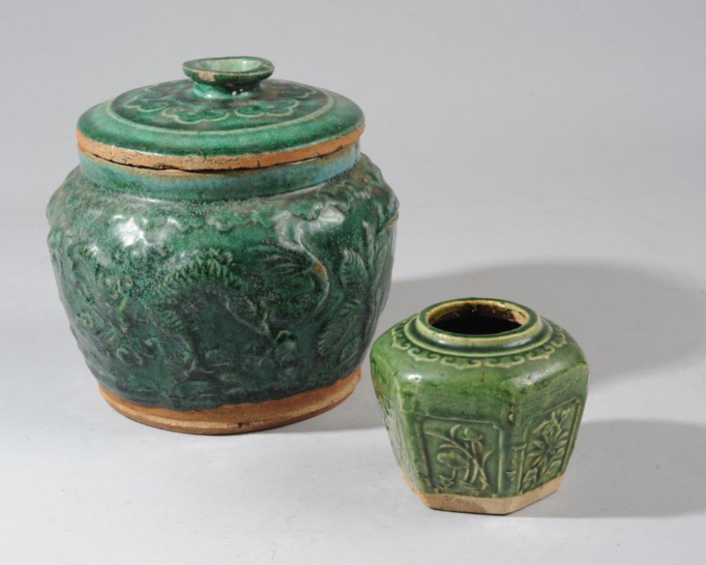 Ming Green Glaze Tobacco or Ginger Jar & Cover+: With emerald green glaze, the sides of the wide mouth jar with relief dragon, deer, rooster, taotie masks, the lid with ruyi border around finial. Ming Dynasty. Collected in Southeast Asia in the 1970