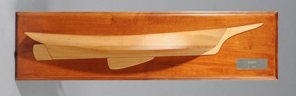 Half Hull Model "Kathryn": Half hull model mounted to backboard with brass plate "Kathryn / C. 1901".Approx. 26" x 6 3/4".