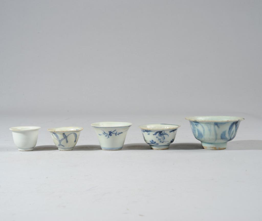 Five Antique Chinese Blue & White Cups: Four very finely potted wine cups, one larger and more heavily potted, a wine or tea cup. One cup with bird on a branch, another with dancing figures and Zhengde mark. All likely Ming. Lagest cup with