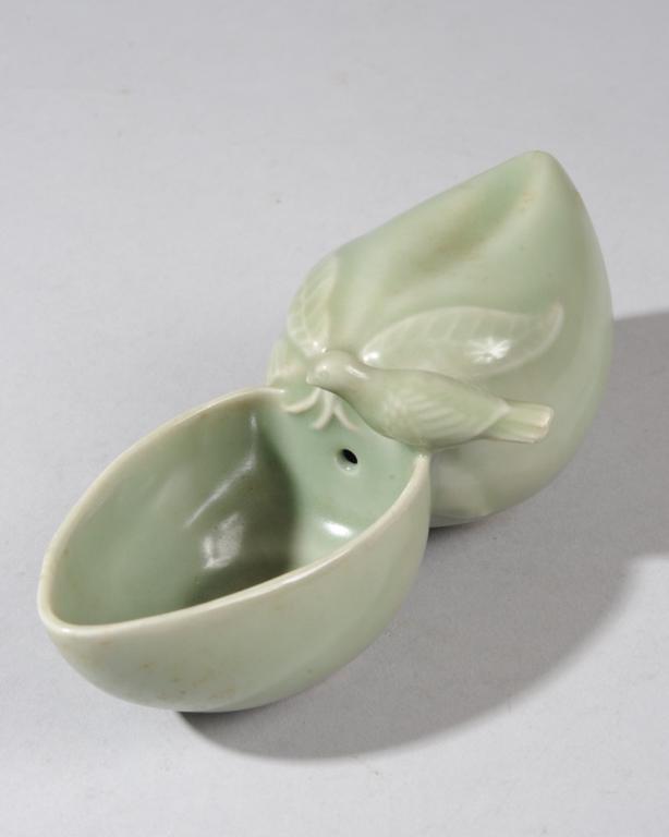 20th C. Chinese Celadon Water Dropper: In the form of two peaches and a bird. Approx. 6 3/5" L x 2 3/4" W x 2 1/3" H.