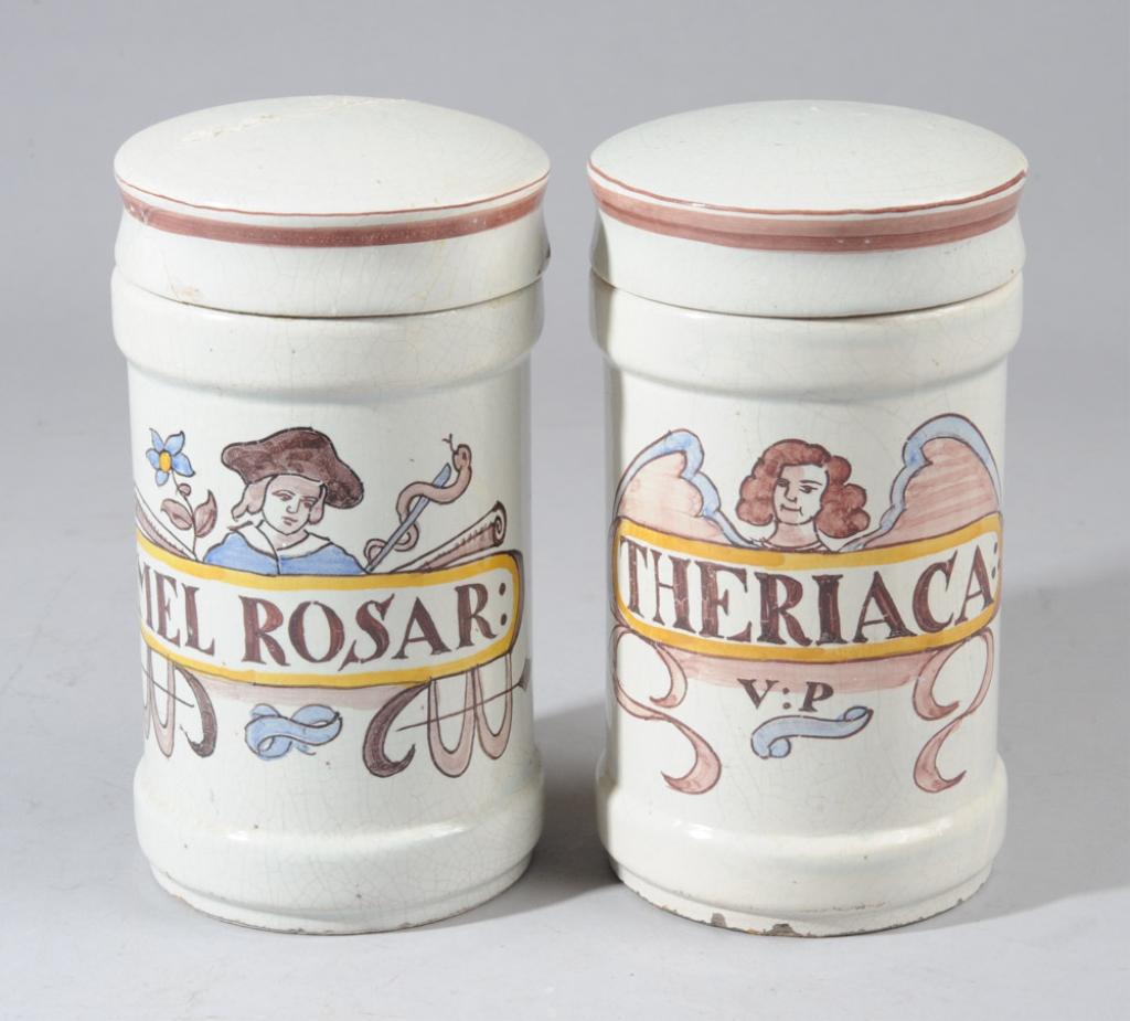 Pair French Faience Apothecary Jars: Hand painted, both with all-over crazing, damaged / repaired lids and in as-found condition.H: approx. 8".